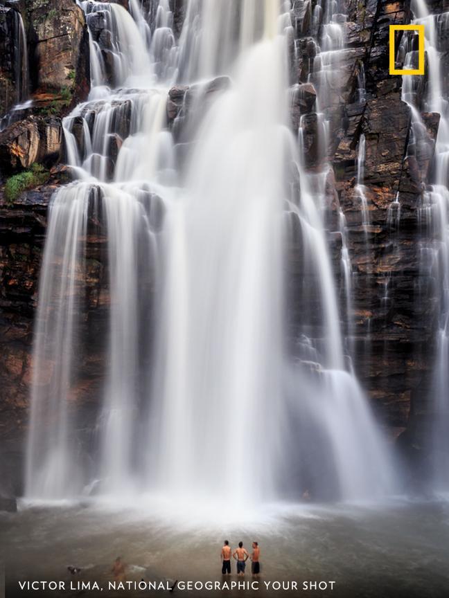 Taken in Salto Corumbá, photographer Victor Lima managed to show the scale of the waterfall when he waited for tourists to stand idly in front of it before capturing this shot. https://on.natgeo.com/2OdU4oe