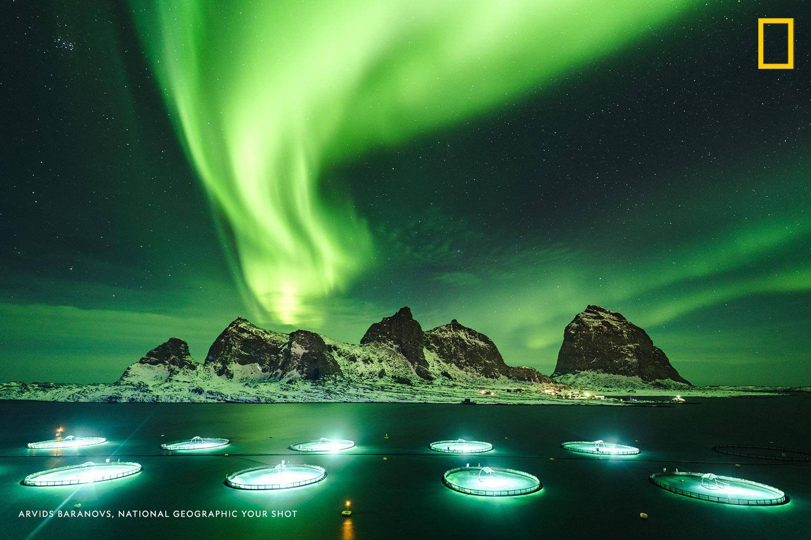 Northern lights dance over the iconic island of Sanna off the Norwegian coast in this long exposure image captured by Your Shot photographer Arvids Baranovs. https://on.natgeo.com/2TJbA7t