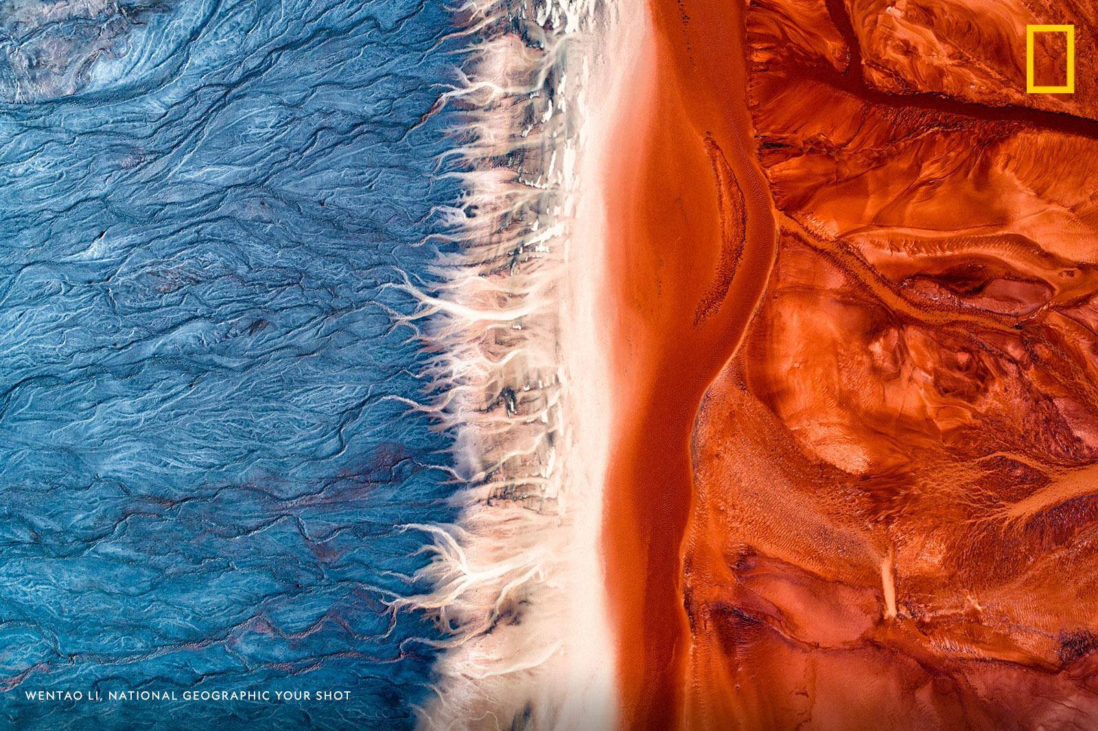 Eye-catching colors invite you to take a closer look at this aerial image captured by Your Shot photographer Wentao Li. "While modern industry promotes the rapid development of human society and economy, it also brings permanent and serious damages to the environment of the earth," Li writes. https://on.natgeo.com/2OXoqJN