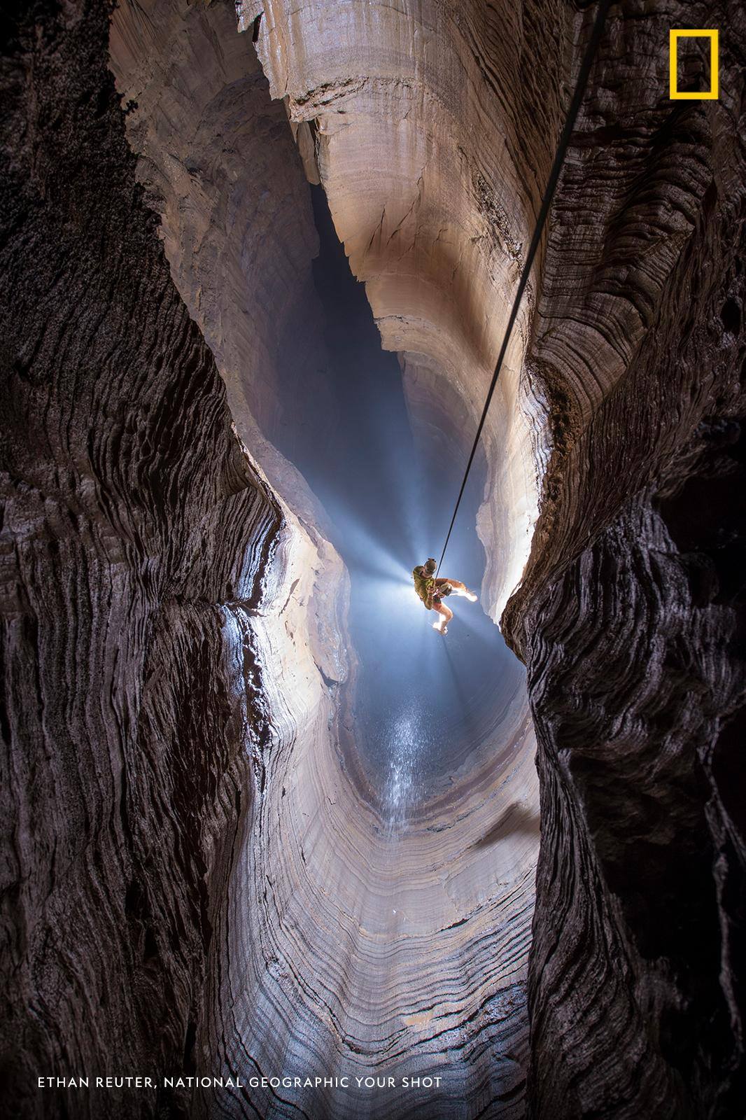 Ellison's Cave in Pigeon Mountain, Georgia, holds the deepest vertical pitch in the continental United States. In this striking image by Your Shot photographer Ethan Reuter, a caver is suspended over one of the cave's seemingly bottomless chasms. https://on.natgeo.com/2Xd2wFC